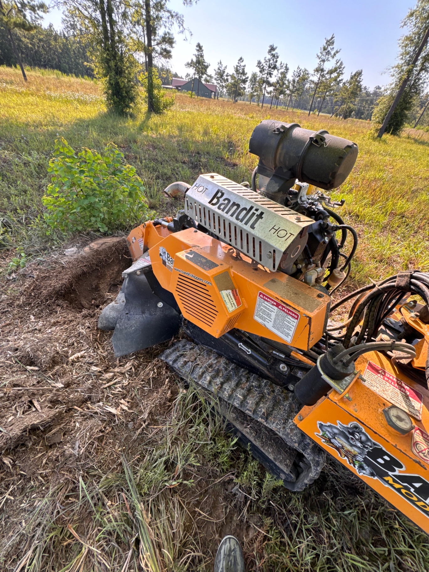 Bandit stump grinder on tracks in the field